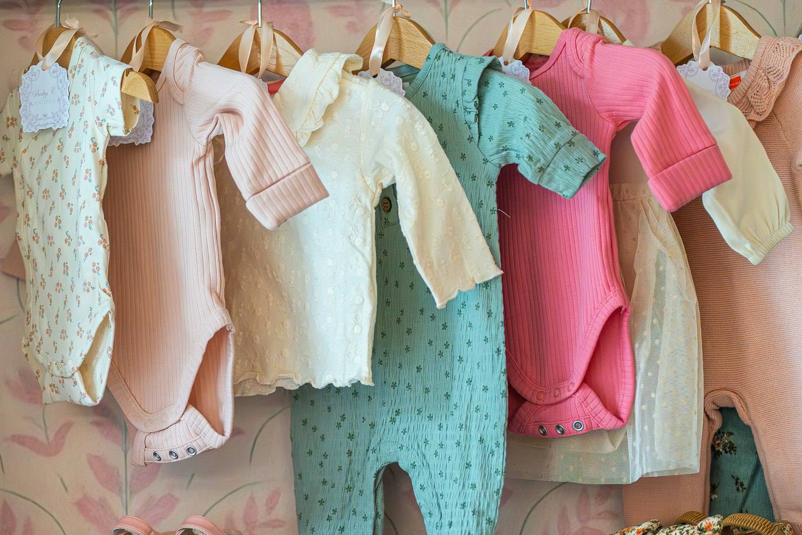 Baby clothes hanging on a rail